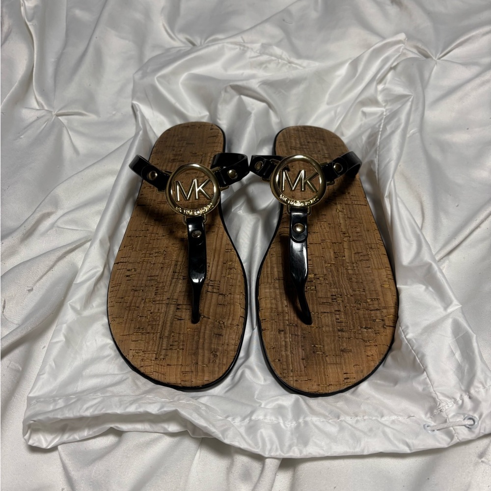 Michael Kors Black and Tan flip flops